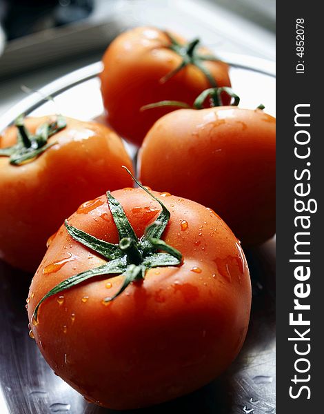 Fresh red tomatoes with water drops. Fresh red tomatoes with water drops