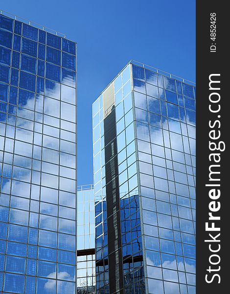 Complex of office buildings with mirror walls in which the sky is reflected. Complex of office buildings with mirror walls in which the sky is reflected