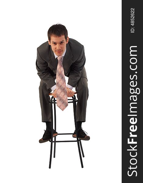 Young businessman on stool