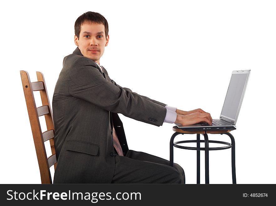 Young businessman works with notebook. Young businessman works with notebook