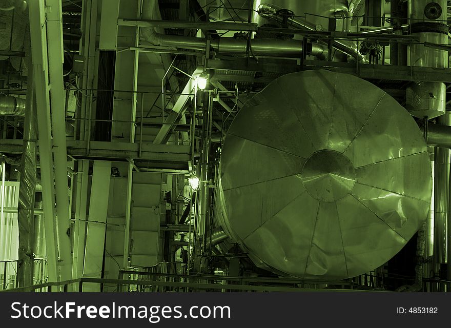 Equipment, cables and piping as found inside of a modern industrial power plant