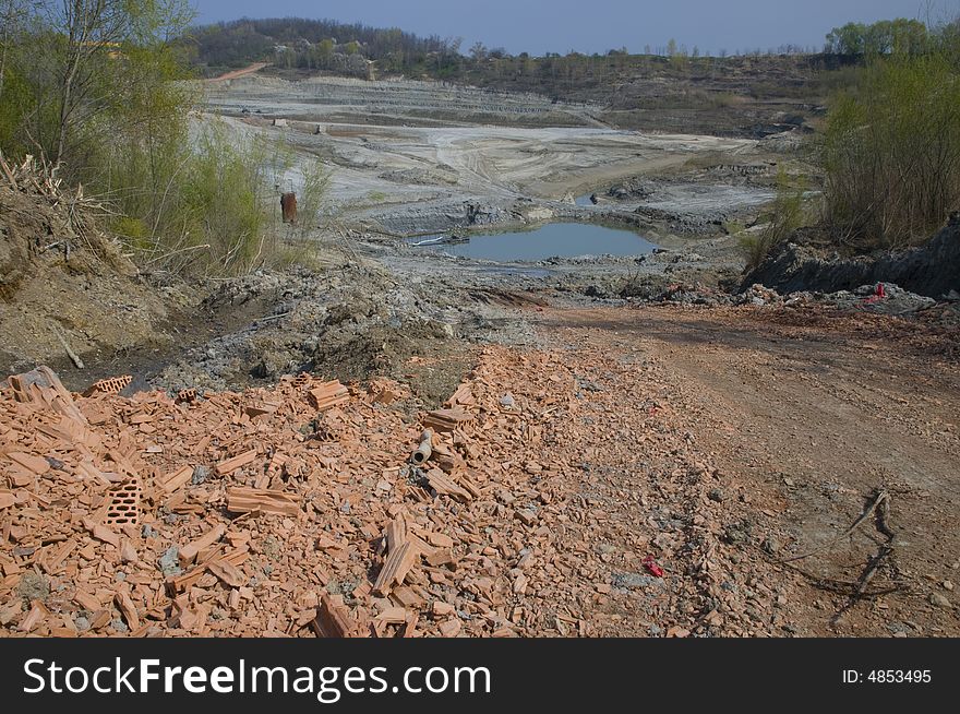 Huge opencast mine for digging the gault with the lake in the middle