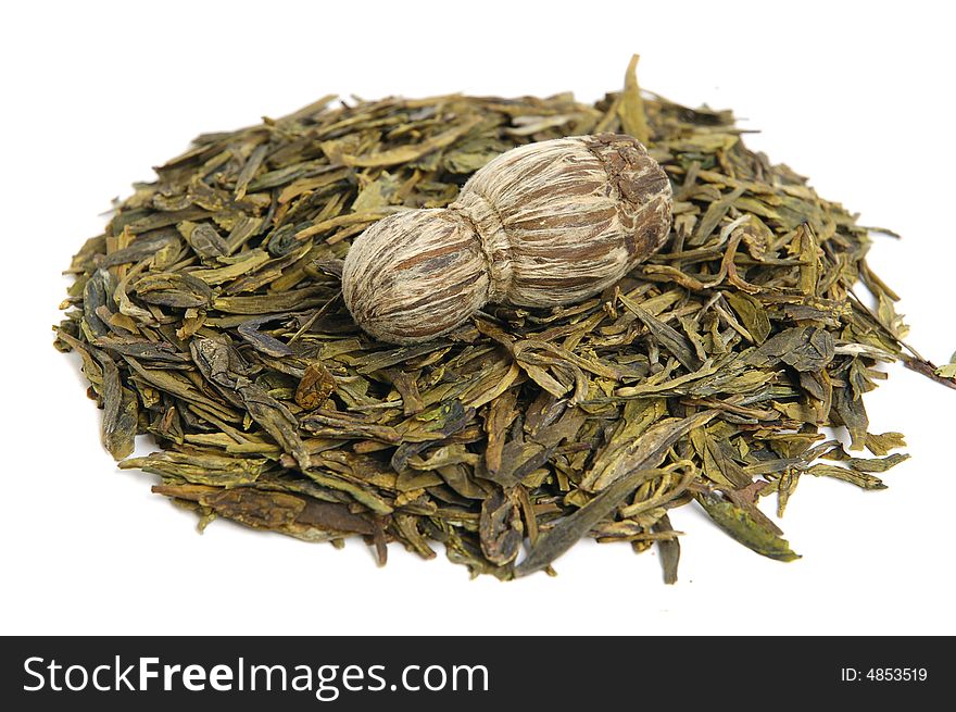 Aromatic green tea leaves on white background