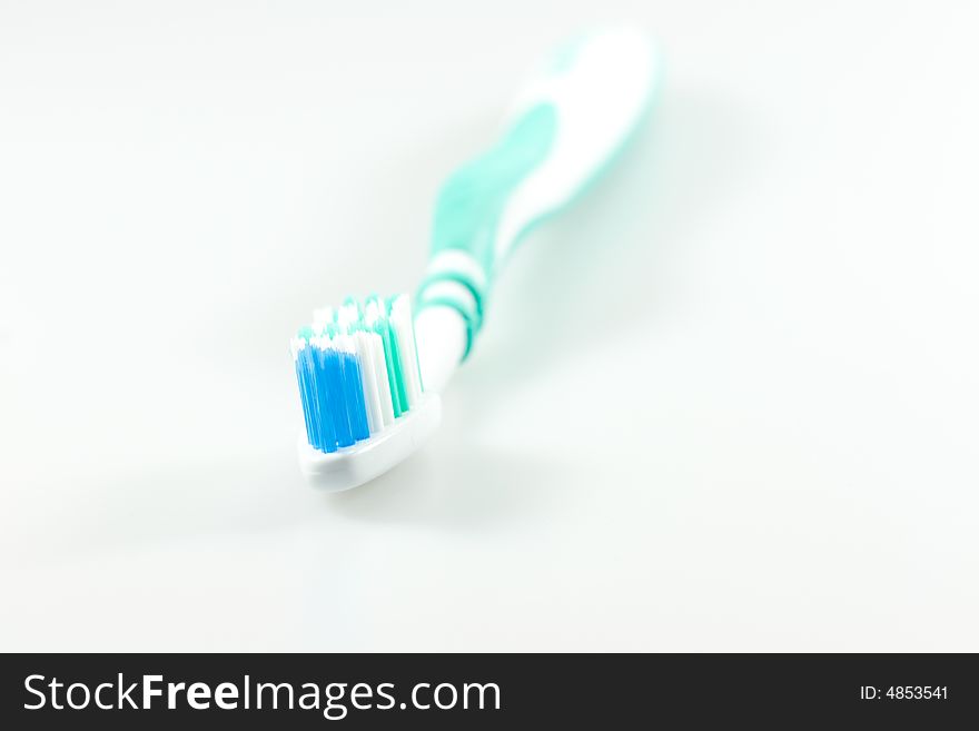 Green and white tooth brush. Green and white tooth brush