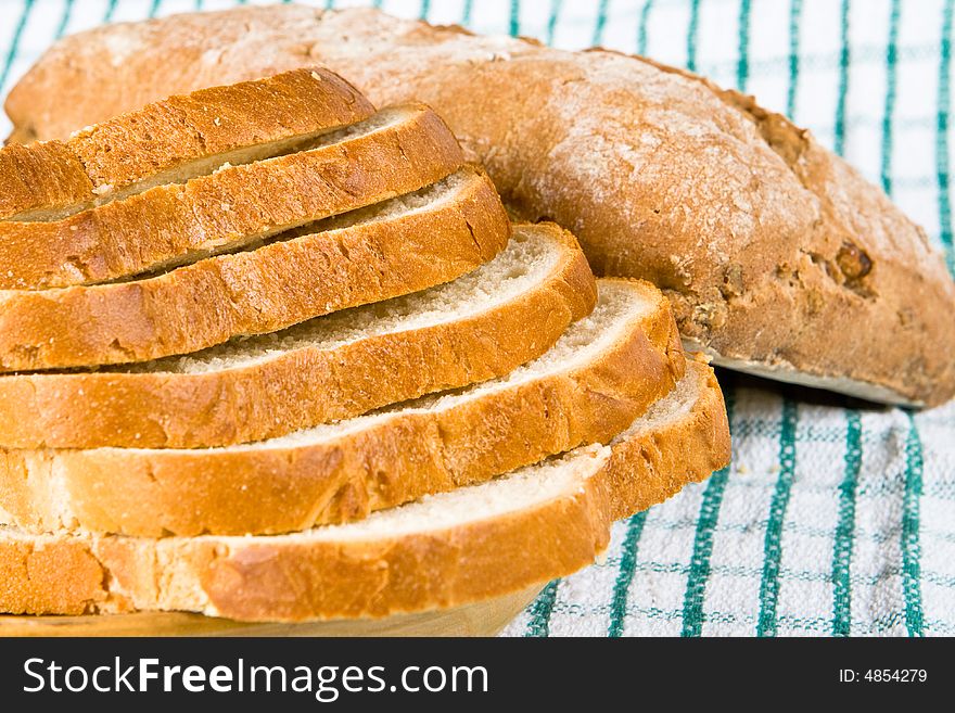 Sliced white bread on a tea cloth