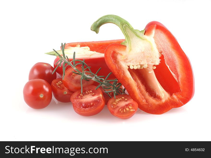 Red paprika, tomatoes and thyme on a white background. Red paprika, tomatoes and thyme on a white background.