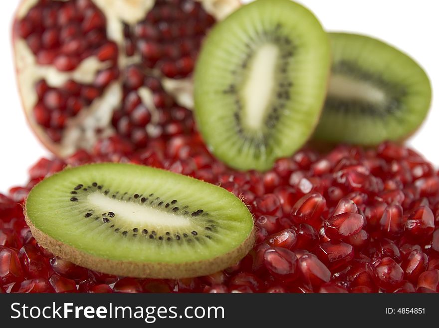 Pomegranates and kiwi isolated on white background. Pomegranates and kiwi isolated on white background