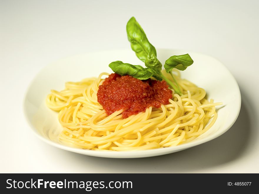 Spaghetti pasta with tomato sauce and basil. Spaghetti pasta with tomato sauce and basil