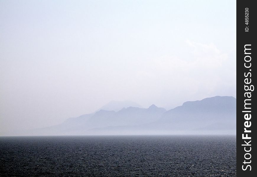 Sea scene in summer with mountains in the background. Sea scene in summer with mountains in the background