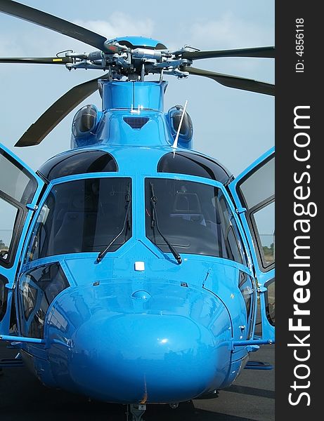 Front view, close up, of large, blue, passenger helicopter. Front view, close up, of large, blue, passenger helicopter