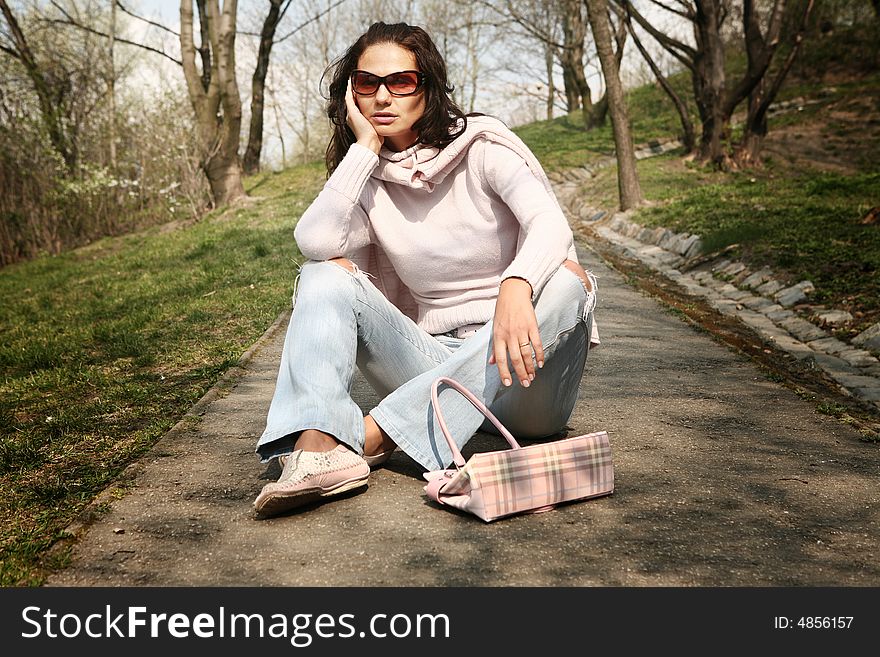 Attractive woman relaxing in the park. Attractive woman relaxing in the park