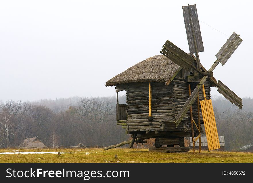 Windmill in ukranian village at winter time. Windmill in ukranian village at winter time