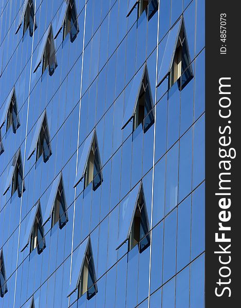 Modern skyscraper window reflections, vertical, close-up