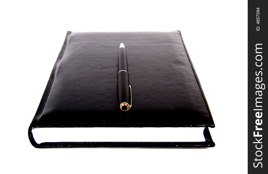 Black material notebook with pen.