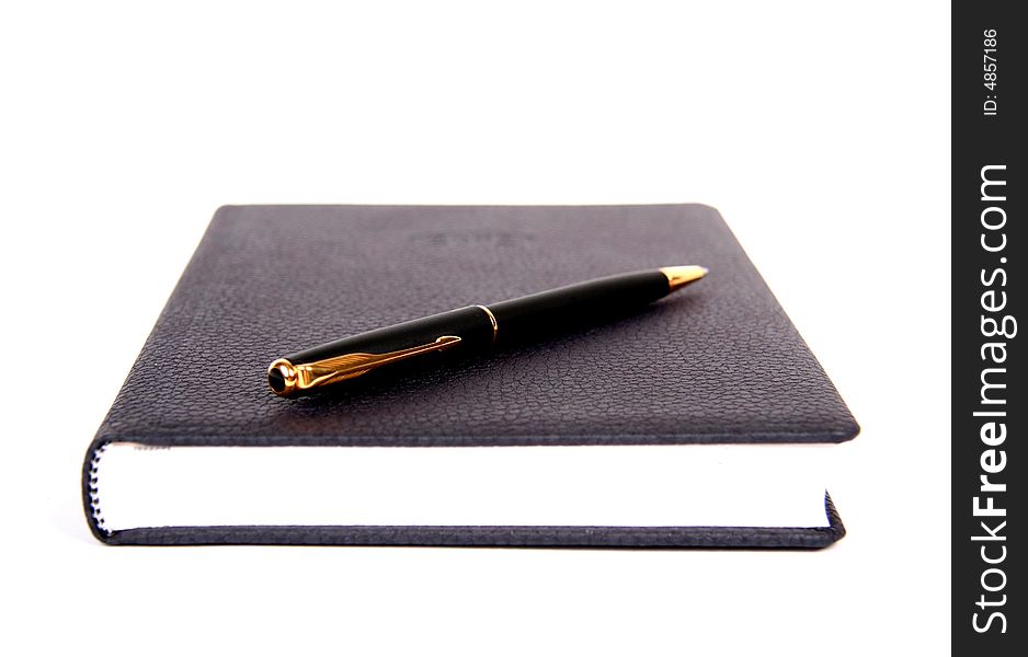 Black material notebook with pen.
