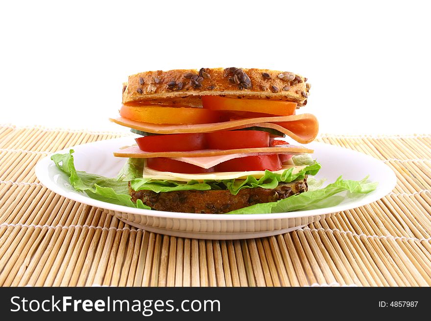 Ham salad sandwich on a plain background