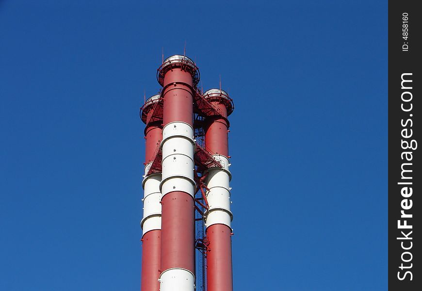 Chimneys on a background of the blue sky