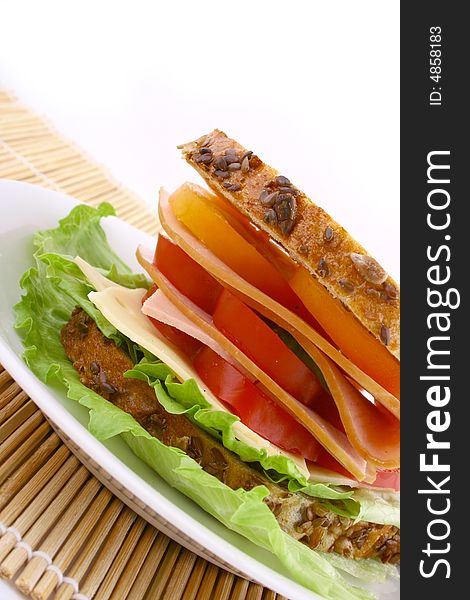 Ham salad sandwich on a plain background