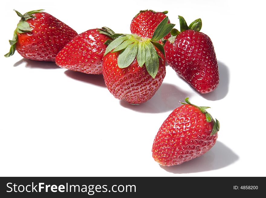 Fresh strawberries macro on white background