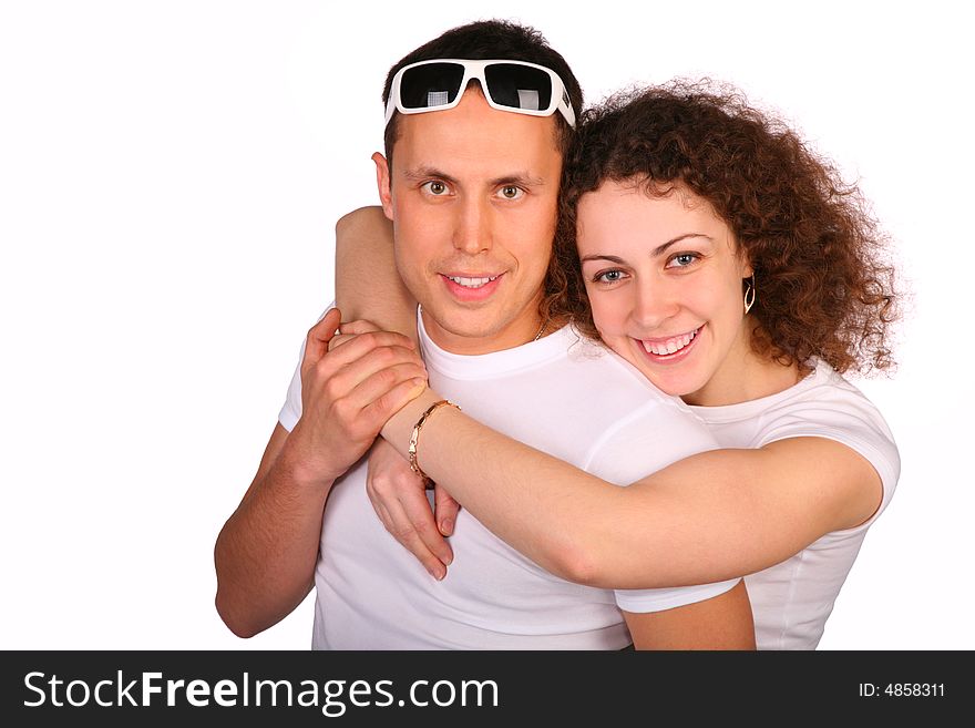 Girl embraces young man from behind. Girl embraces young man from behind