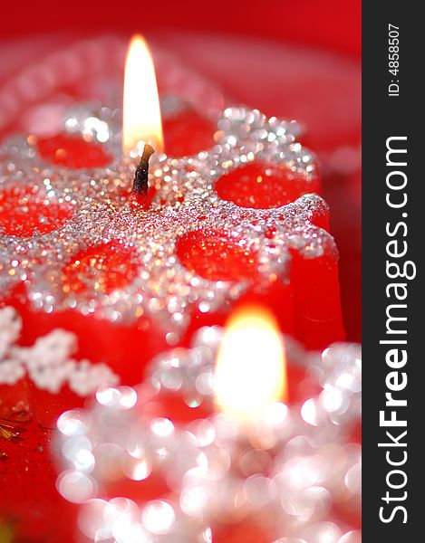 Red candles on the red background. Narrow depth of field. Red candles on the red background. Narrow depth of field.