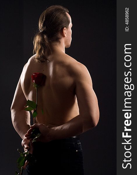 Standing man with red rose. Standing man with red rose