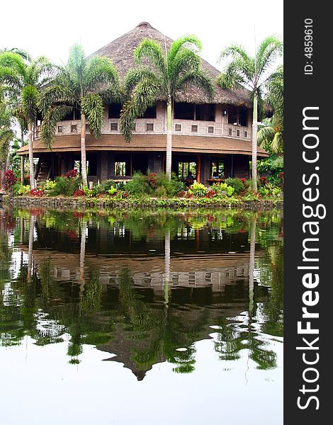 Reflections of a diner by the pond