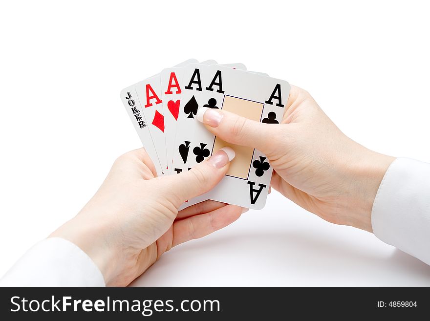 Woman hands holding playing cards with four aces and a jocker combination. Woman hands holding playing cards with four aces and a jocker combination