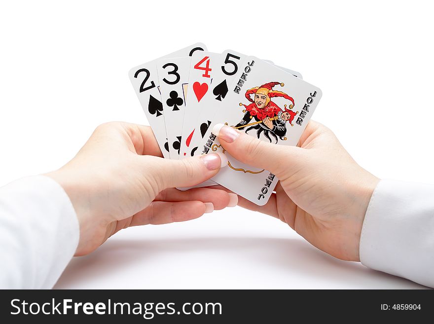 Woman hands holding playing cards with poker straight combination and a joker. Woman hands holding playing cards with poker straight combination and a joker