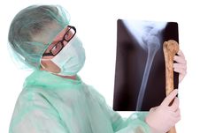 Surgeon With Xray And Bone Stock Photo