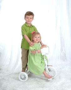 Siblings On Tricycle Royalty Free Stock Photo