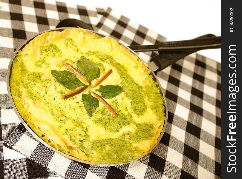 Spinach lasagna served in a frying pan