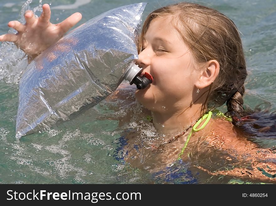 Girl-teenager among waves in a sea. Girl-teenager among waves in a sea