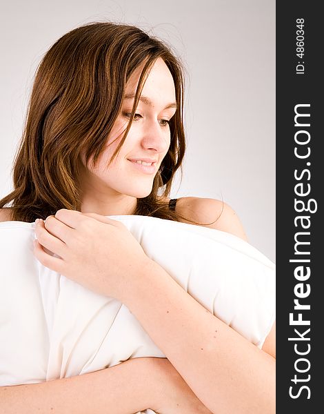 Young woman portrait in the studio on a white background. Young woman portrait in the studio on a white background