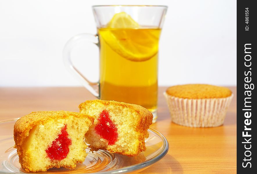 Cakes and the cup of tea with the lemon. Cakes and the cup of tea with the lemon