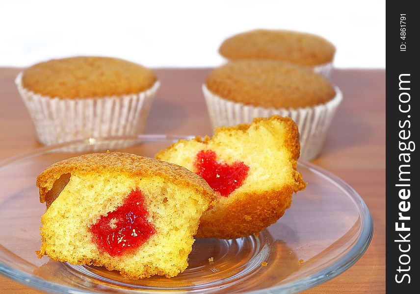 Sweet cakes on the table on transparent plate