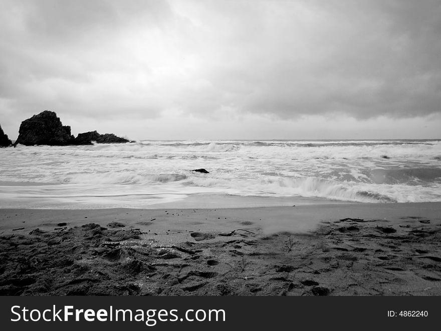 A sandy beach on a scenic, cloudy afternoon. A sandy beach on a scenic, cloudy afternoon