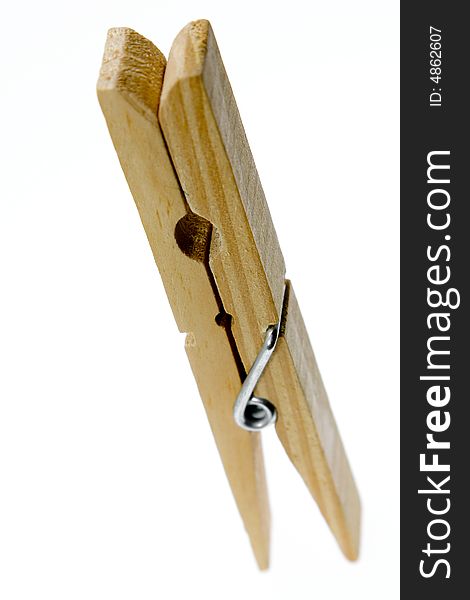 One isolated wooden clothespin (photo). One isolated wooden clothespin (photo)