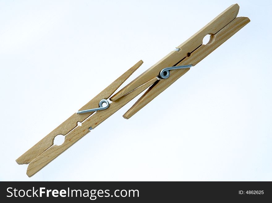 Two isolated wooden clothespins (photo). Two isolated wooden clothespins (photo)