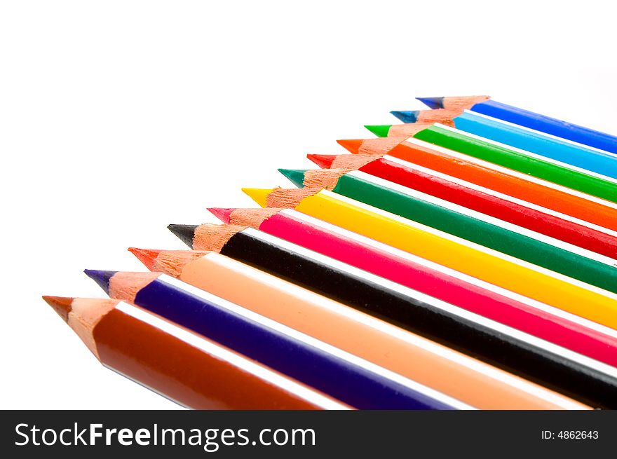 Colored wooden crayons isolated on white background. Colored wooden crayons isolated on white background