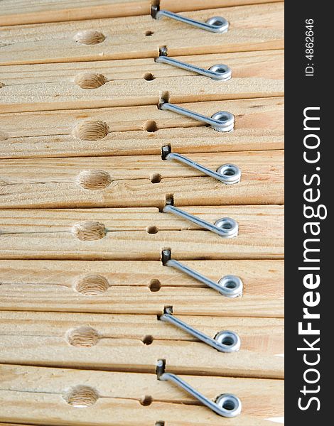 Eight isolated wooden clothespins in a row. Eight isolated wooden clothespins in a row