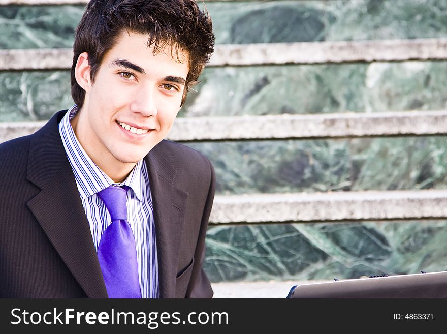 Young and smiling businessman portrait. Young and smiling businessman portrait