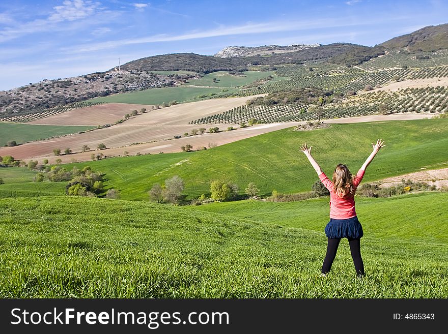 Young Woman With Raised Arms