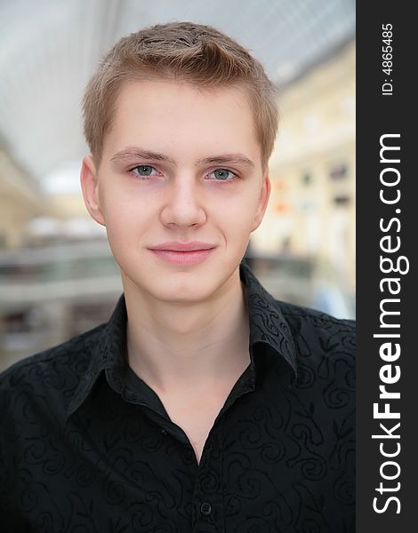 Young man in black shirt indoor