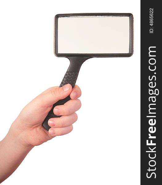 Hand holds magnifier on white