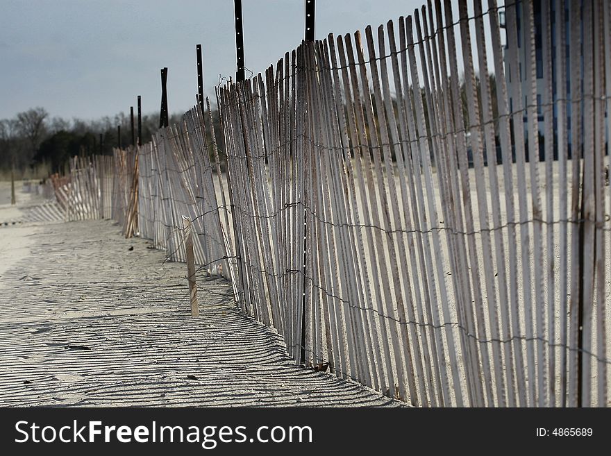 A beach fence along a Canadian lake.