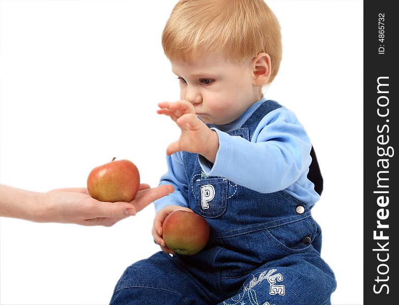 The small beautiful boy with two apples. The small beautiful boy with two apples