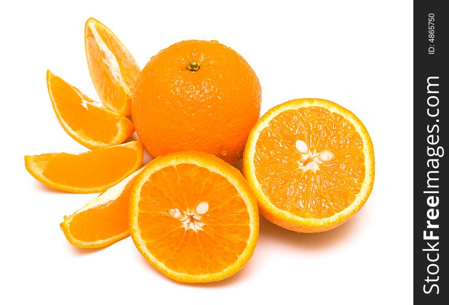 The ripe whole oranges covered by drops of a water. Isolation on white, shallow DOF. The ripe whole oranges covered by drops of a water. Isolation on white, shallow DOF.