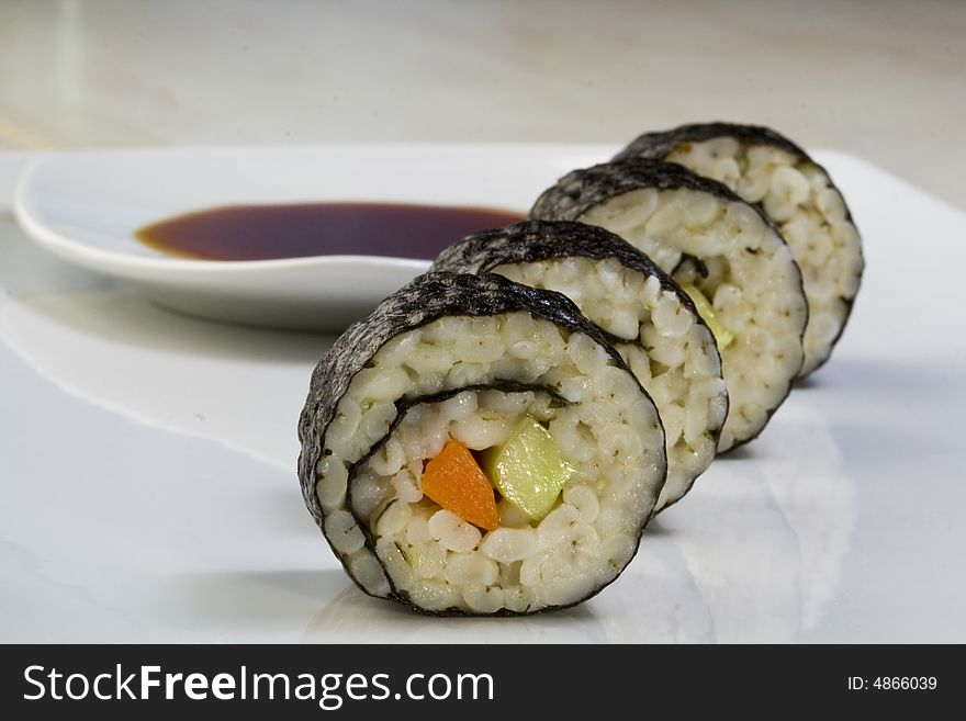 A portion of sushi made of oatmeal. A portion of sushi made of oatmeal