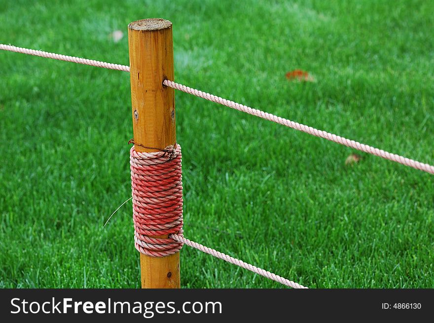 Fence of the lawn in the park.